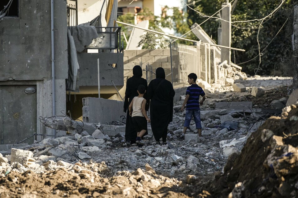 Residents inspect the destruction the morning after a night airstrike by the Israeli military that targeted the southern Lebanese village of Mayfadoun on September 5, 2026.