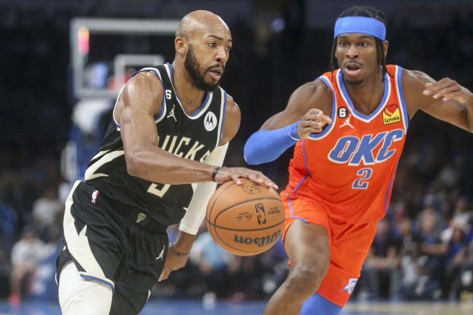 Milwaukee Bucks guard Jevon Carter drives past Oklahoma City Thunder guard Shai Gilgeous-Alexander during the first quarter at Paycom Center.