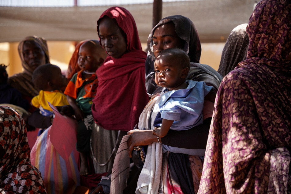 Women and babies are pictured at the Zamzam displacement camp, close to El Fasher in North Darfur, Sudan, in January 2024.