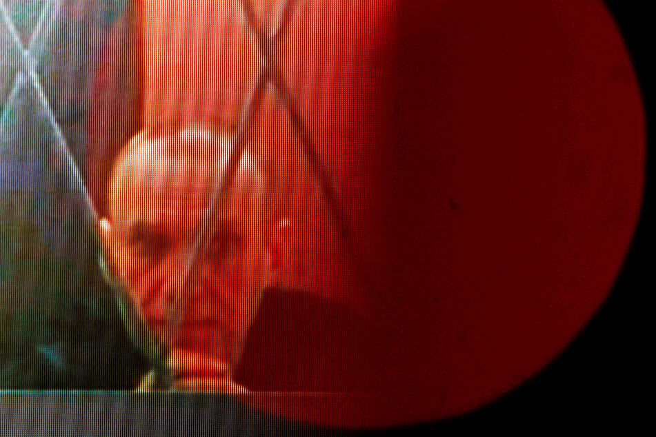Alexei Navalny appears on a screen via a video link from the IK-3 penal colony in Kharp in Russia's Yamal-Nenets region on January 11, 2024.
