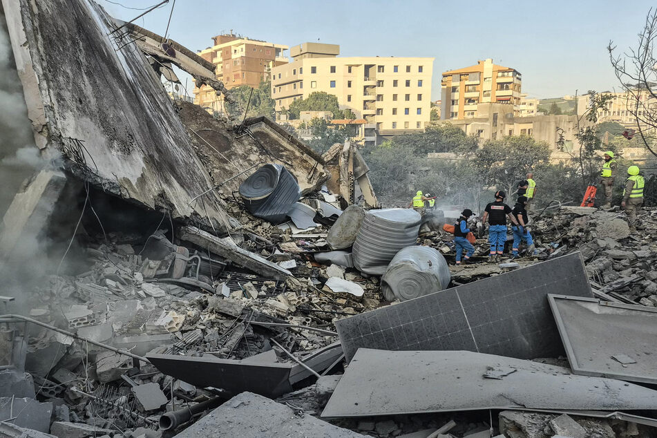 First responders search the rubble for victims at the site of an Israeli airstrike in Nabatieh, Lebanon, on May 9, 2026.