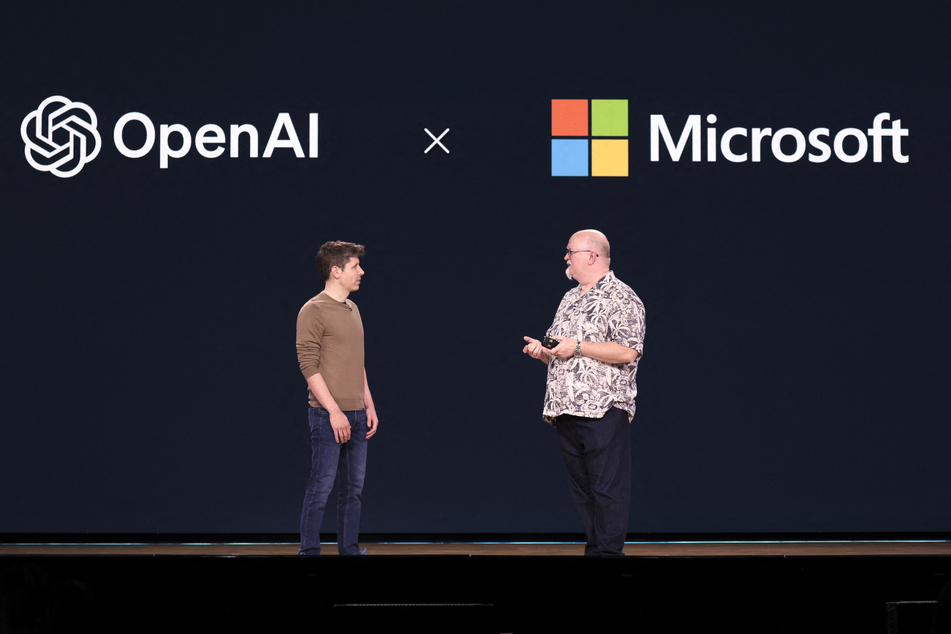 OpenAI CEO Sam Altman (l.) speaks with Microsoft Chief Technology Officer and Executive VP of Artificial Intelligence Kevin Scott (r.) during the Microsoft Build conference at the Seattle Convention Center Summit Building in Seattle, Washington on May 21, 2024.