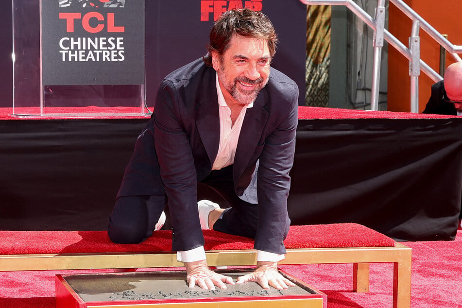 Javier Bardem poses during his hand and footprint ceremony at the TCL Chinese Theatre in Hollywood, California, on June 16, 2026.