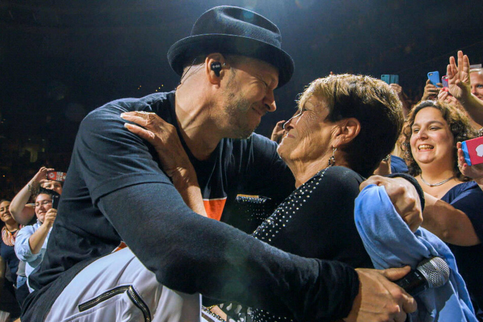 Donnie hugged his mother Alma at a concert in 2010.