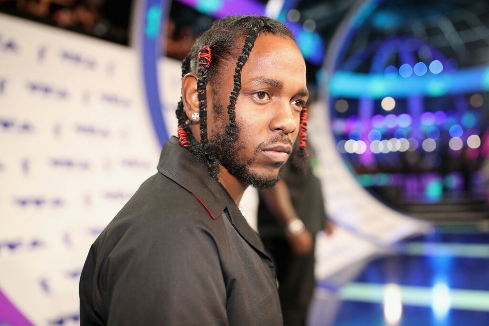 Grammy-winning rapper Kendrick Lamar revealed the cover art for his new album, fueling speculation about his growing family.