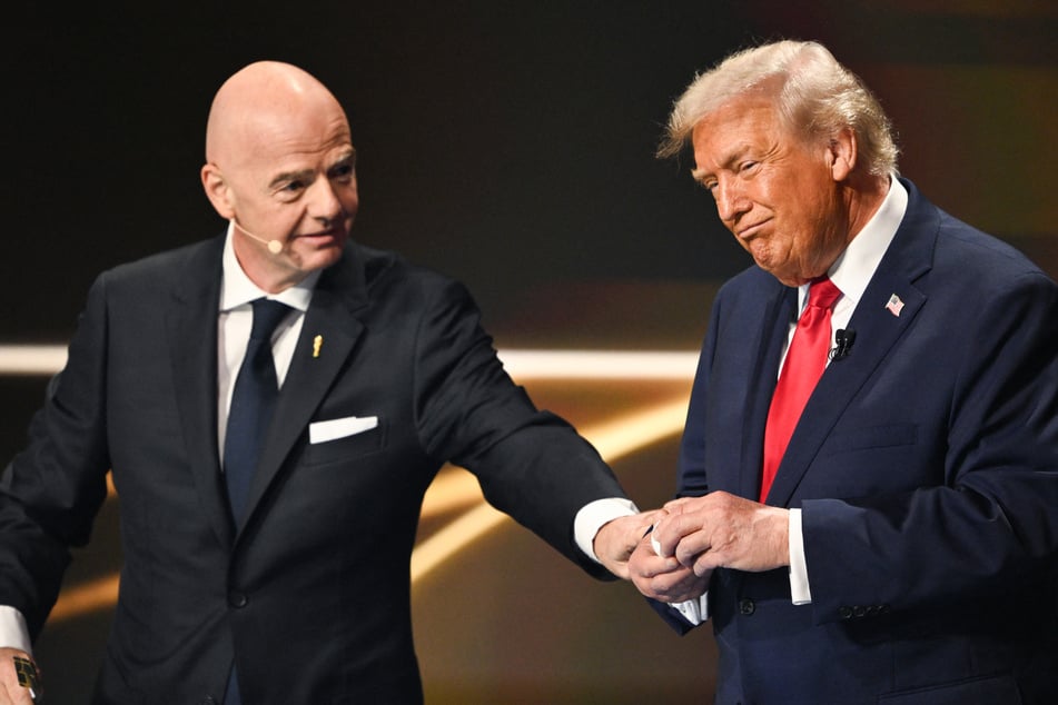 FIFA President Gianni Infantino (l.) has been accused of breaching his duty of neutrality by presenting the soccer body's first-ever peace prize to Donald Trump.