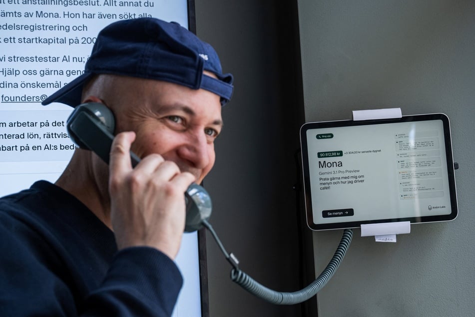Andreu Vizquerra, a tourist from Spain, speaks with the AI assistant Mona at the Andon Café in Stockholm on April 27, 2026.