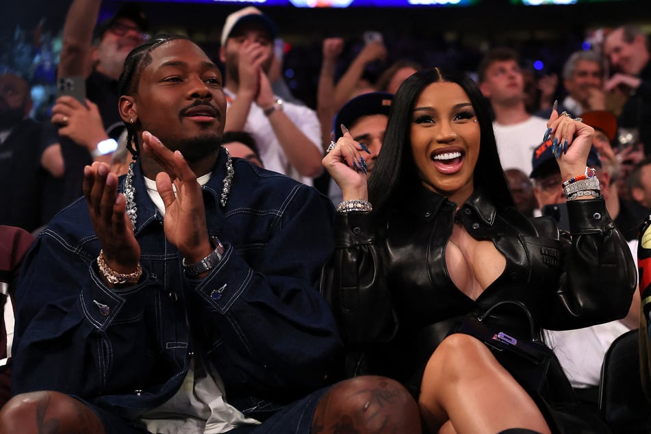 Cardi B (r.) told fans she hasn't "been this happy in a very, very long time" as she spilled on her new romance with Stefon Diggs.