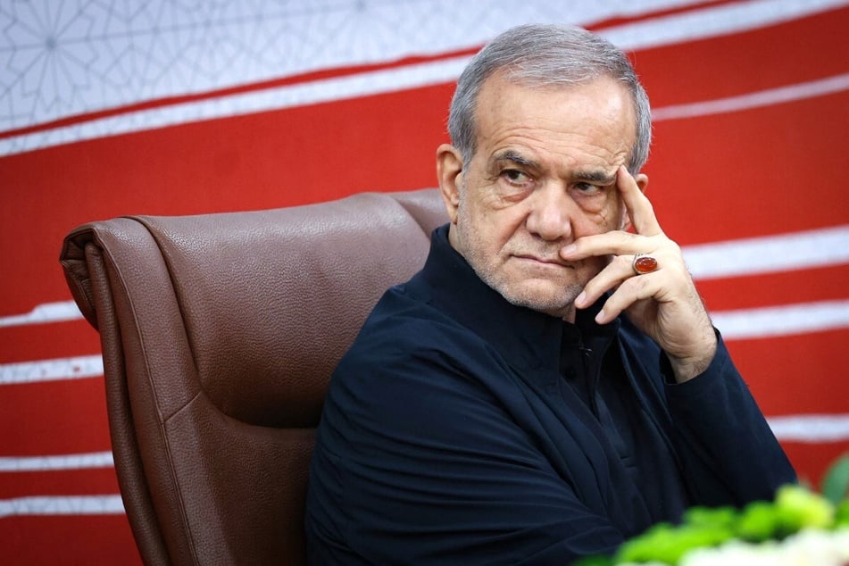 A handout photo made available by the Iranian Presidential Office shows Iran's President Masoud Pezeshkian attending a press conference in Tehran on August 8, 2026.