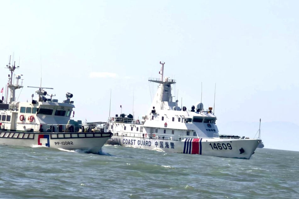A Taiwan Coast Guard vessel travels near a China Coast Guard vessel as China conducts military drills around Taiwan on December 30, 2025.