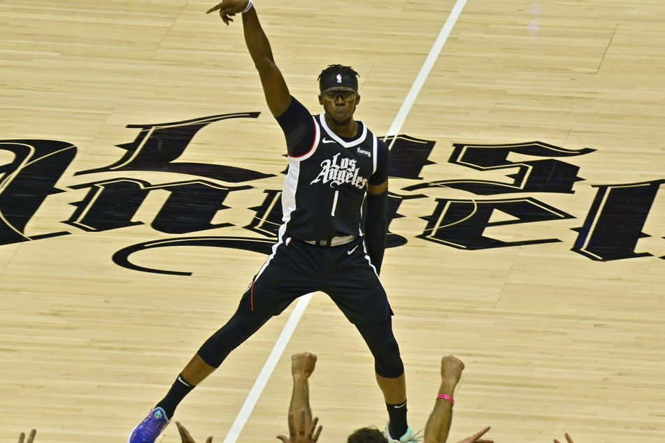 Reggie Jackson celebrates after hitting a three-pointer during the fourth quarter.