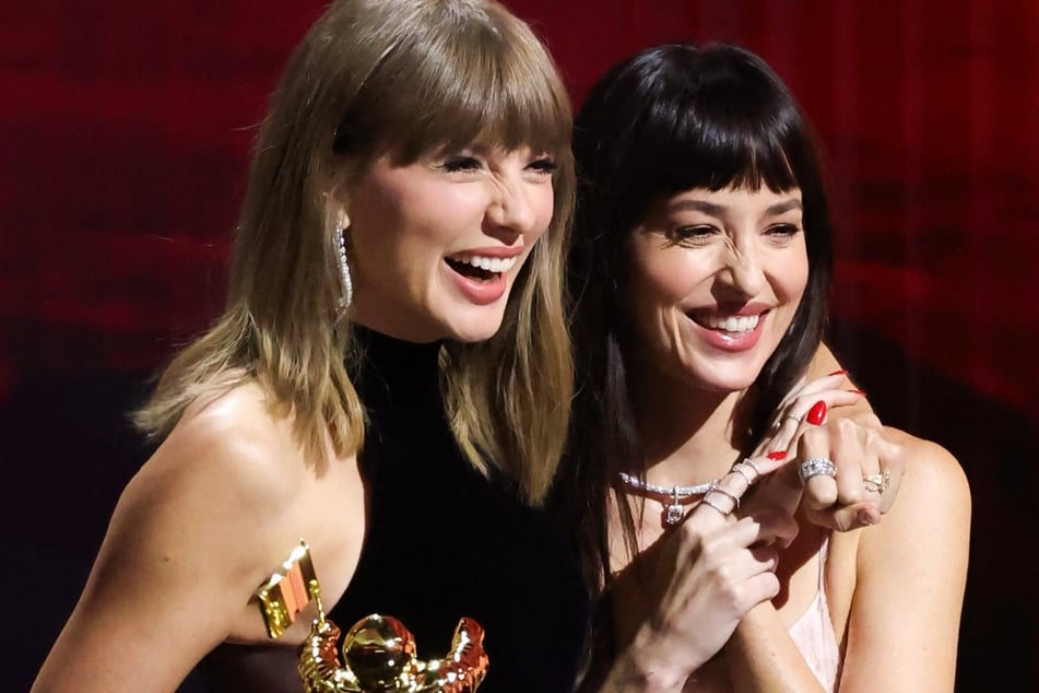 Dakota Johnson (r.) spilled a little tea on Taylor Swift's (l.) Madison Square Garden nuptials to Travis Kelce and whether any pics will be leaked from their wedding.