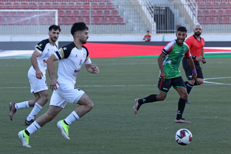 Players from Jabal Al-Mukaber and Shabab Al-Khalil compete during their match at the 1,000 Martyrs' Cup in Faisal Al-Husseini International Stadium in the West Bank city of Al-Ram on September 4, 2026.