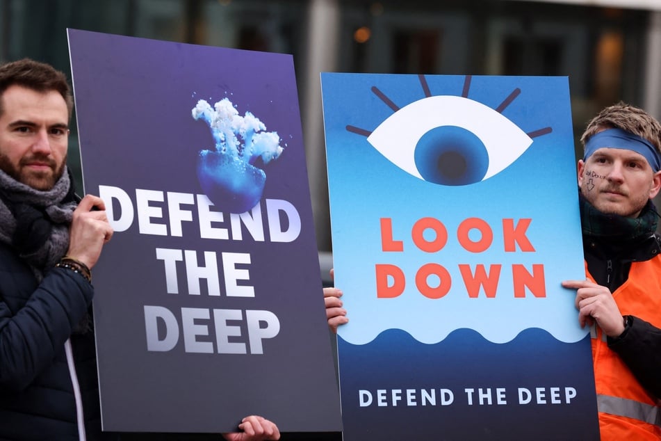 Activists take part in a rally to stop deep-sea mining outside the European Parliament in Brussels on March 6, 2023. Critics of the practice fear it will cause irreversible environmental damage.