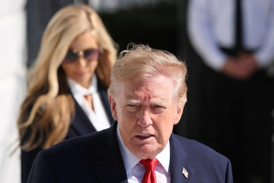 President Donald Trump (r.) has reportedly fired his new press secretary, Katie Zacharia, amid allegations of lying about her legal credentials.