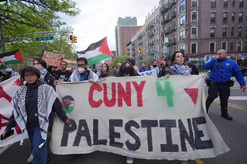 Protesters hold a "CUNY 4 Palestine" banner as they march from Columbia University to City College of New York on April 30, 2026.