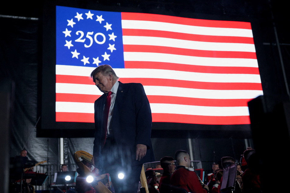 Donald Trump walks off stage after speaking at a rally on the National Mall on June 24, 2026.
