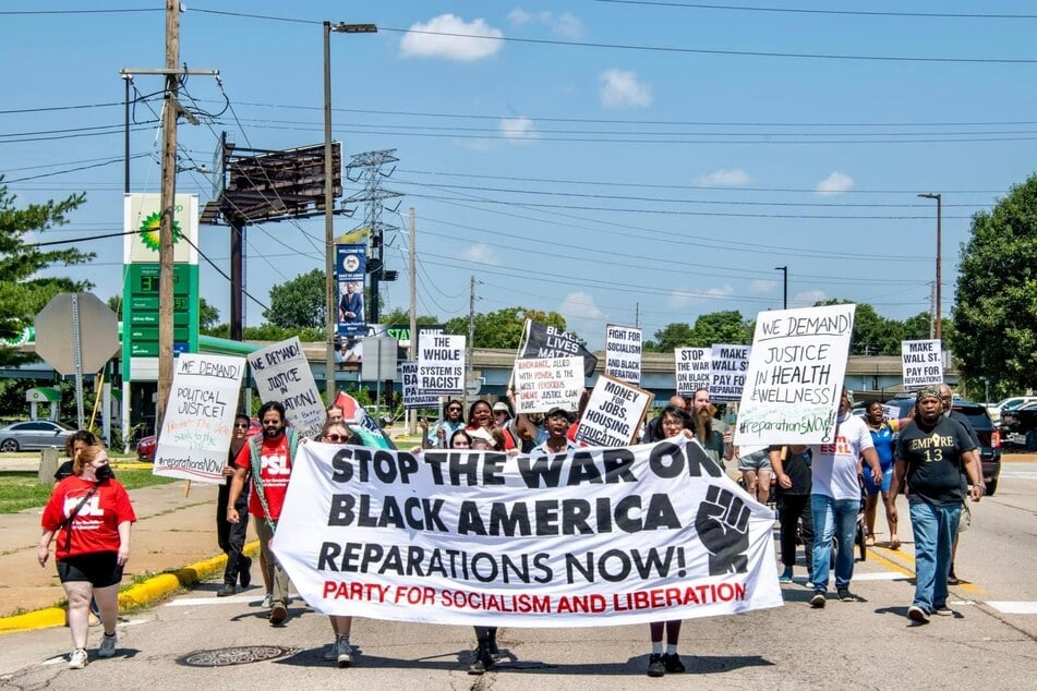 East St. Louis residents demand reparative justice as they march to commemorate the anniversary of the city's 1917 race massacre.