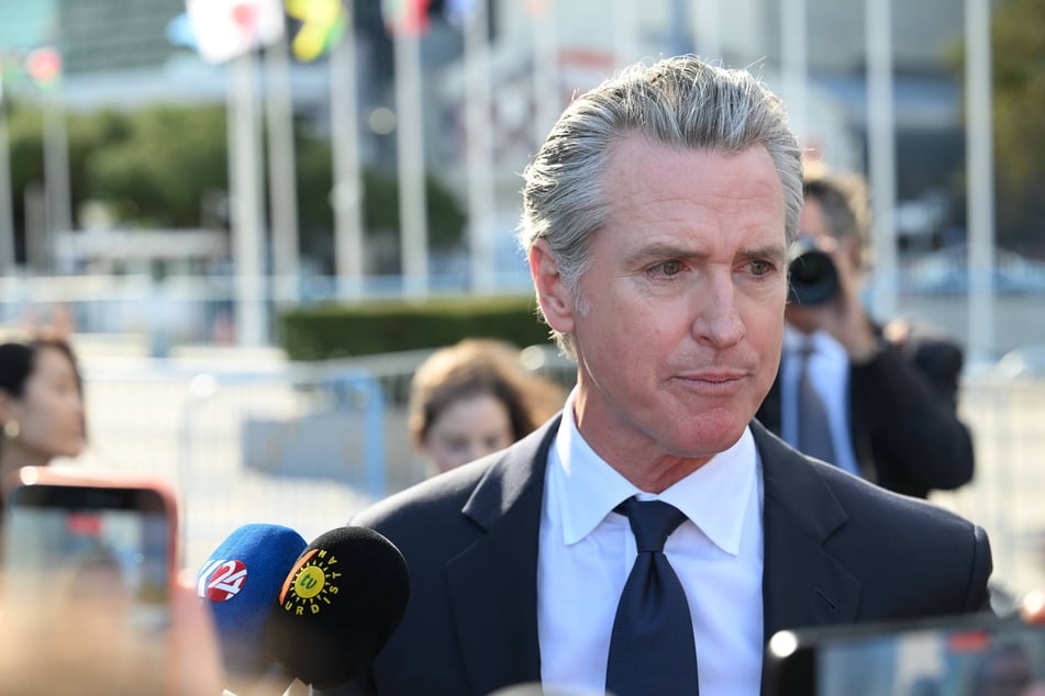 California Governor Gavin Newsom speaks to reporters outside the United Nations headquarters in New York last week. On Thursday, he signed a bill into law requiring that corporations disclose whether they profited from slavery.