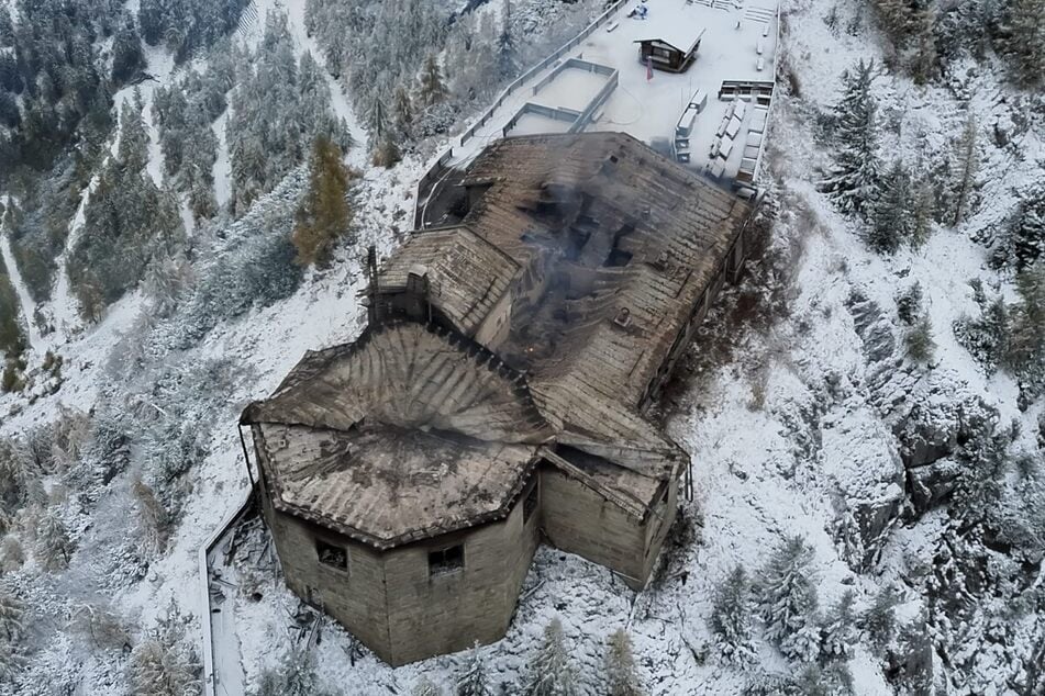 This aerial photo shows the burnt mountain guesthouse known as the Eagle's Nest, formerly Adolf Hitler's mountain retreat, after a large fire broke out at the site on October 23, 2026. A suspect was detained and underwent psychiatric testing.