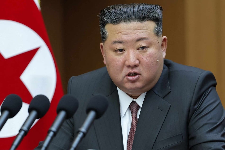 This picture taken on March 23, 2026 and released by North Korea's official Korean Central News Agency (KCNA) on March 24, 2026 shows North Korean leader Kim Jong Un delivering a policy speech at the First Session of the 15th Supreme People's Assembly at the Assembly Hall in Pyongyang.