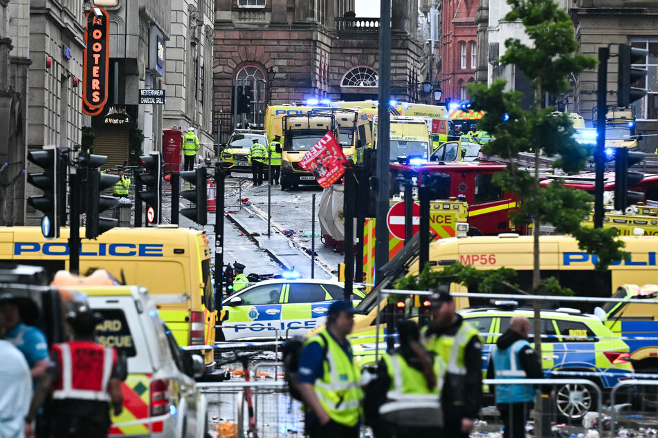 Car rams Liverpool Premier League title victory parade leaving trail of injured fans in its wake