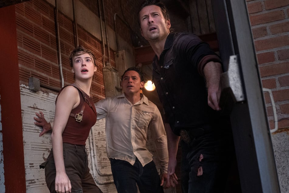 (From l. to r.) Daisy Edgar Jones, Anthony Ramos, and Glen Powell lead the ensemble of Twisters, hitting theaters on July 17.