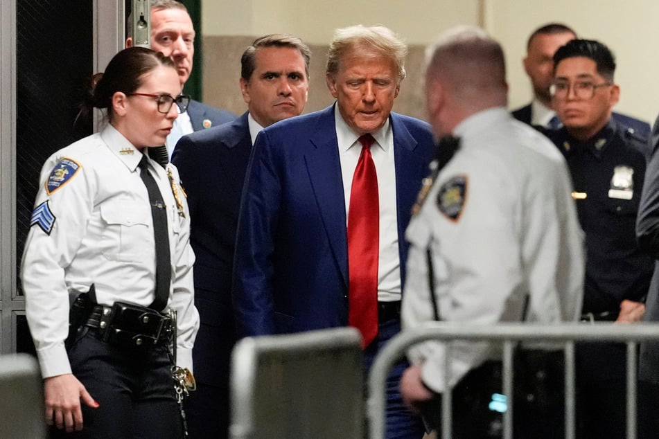 Donald Trump (c.) failed in his latest attempt to have his criminal hush money trial postponed as an appeals judge rejected his request.