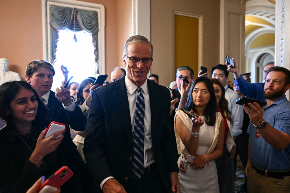 Senate Majority Leader John Thune is surrounded by reporters as he walks to a meeting with Senate Republicans at the US Capitol in Washington DC on June 4, 2026.