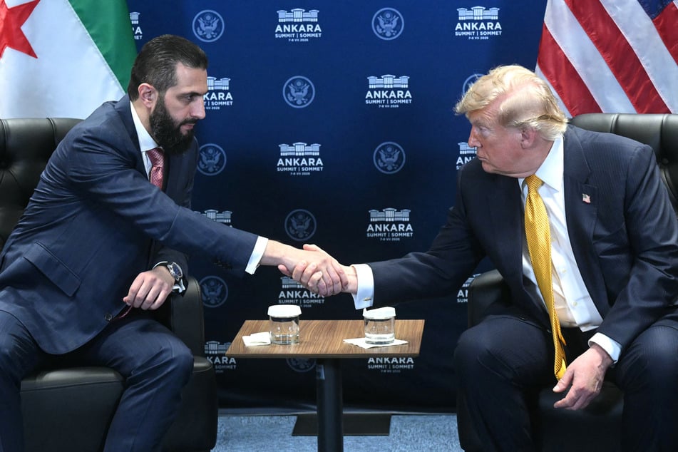 US President Donald Trump (r) meets Syrian President Ahmed al-Sharaa (l) on the sidelines of the NATO Summit at Bestepe Presidential Compound in Ankara, on Wednesday.