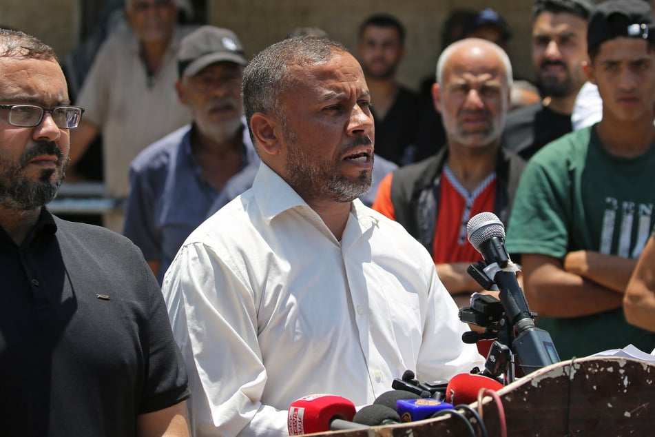 Ismail al-Thawabta, head of Hamas' government media office, addresses a press conference at the Al-Aqsa Hospital in Deir al-Balah, central Gaza Strip, on Monday.