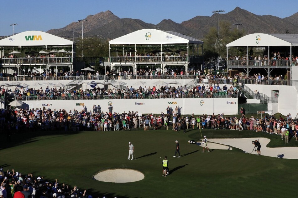 Scottie Scheffler of the United States reacts after a birdie on the third playoff hole to win the WM Phoenix Open at TPC Scottsdale on February 13, 2022.