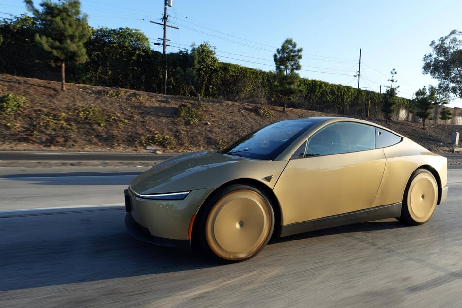 A Tesla Cybercab pictured on the California State Route 60 freeway in August. Elon Musk's electric vehicle maker will debut the new robotaxi on Thursday.