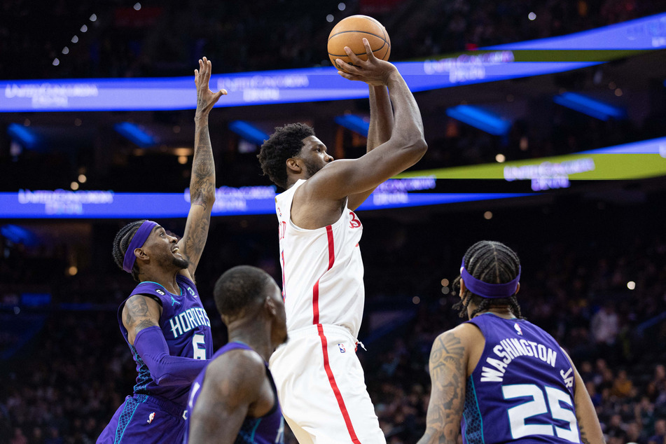 Sixers big man Joel Embiid (2nd from r.) scored 53 points against the Hornets in the NBA.
