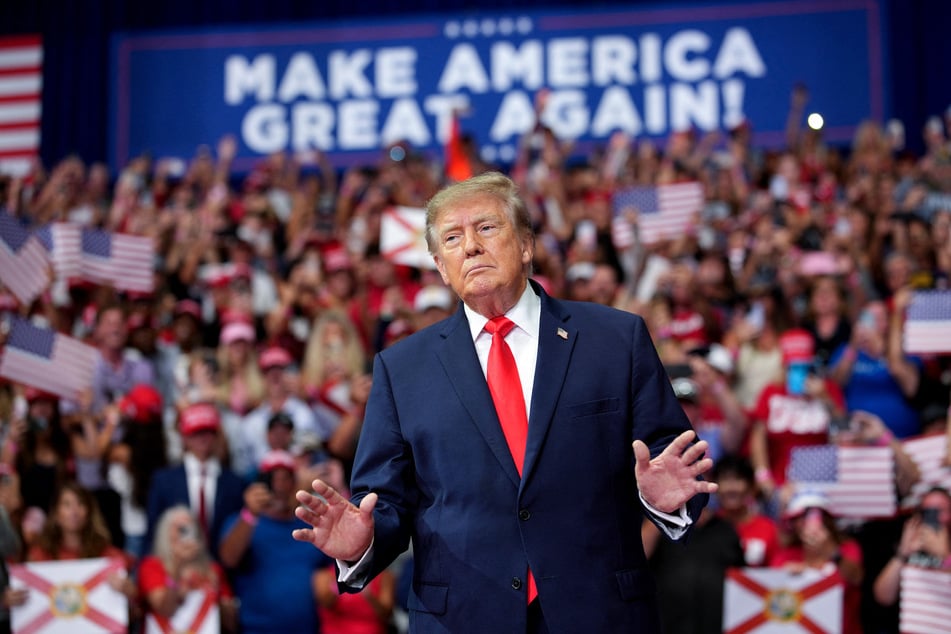 President Donald Trump takes the stage during a campaign rally at the Ocean Center Arena on Friday in Daytona Beach, Florida. Trump has been leaning into baseless claims of voter fraud ahead of the midterm elections.