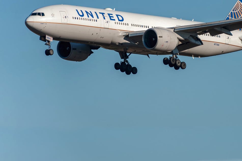 United passenger tries to open plane door mid-flight and attacks flight attendant