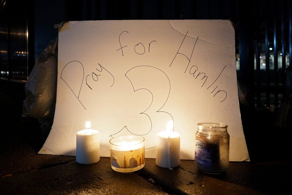 Buffalo Bills fans gathered to hold vigil for Damar Hamlin at the University of Cincinnati Medical Center.
