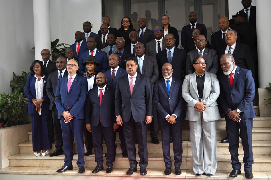 Haiti's Prime Minister Alix Didier Fils Aime, former members of the Transitional Presidential Council, and other officials gather for a photo after a ceremony in Port‑au‑Prince on February 7, 2026.