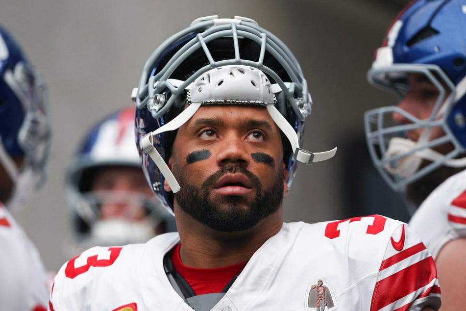 Russell Wilson of the New York Giants looks on from the tunnel prior to the game against the Las Vegas Raiders at Allegiant Stadium on December 28, 2025.