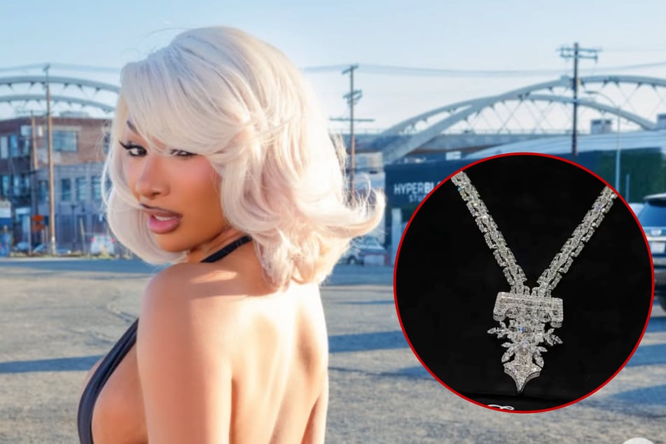 Megan Thee Stallion is really embracing her alter ego Tina Snow as she debuted a new snowflake diamond chain.