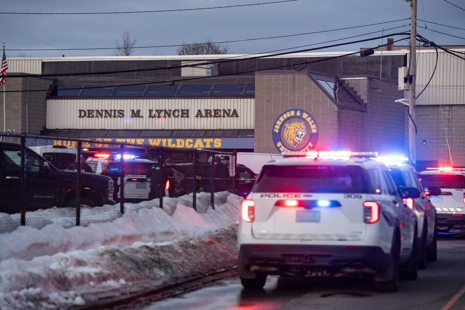 Police stand outside the perimeter they created around the Dennis M. Lynch Arena where a shooting occurred in Pawtucket, Rhode Island, on February 16, 2026.