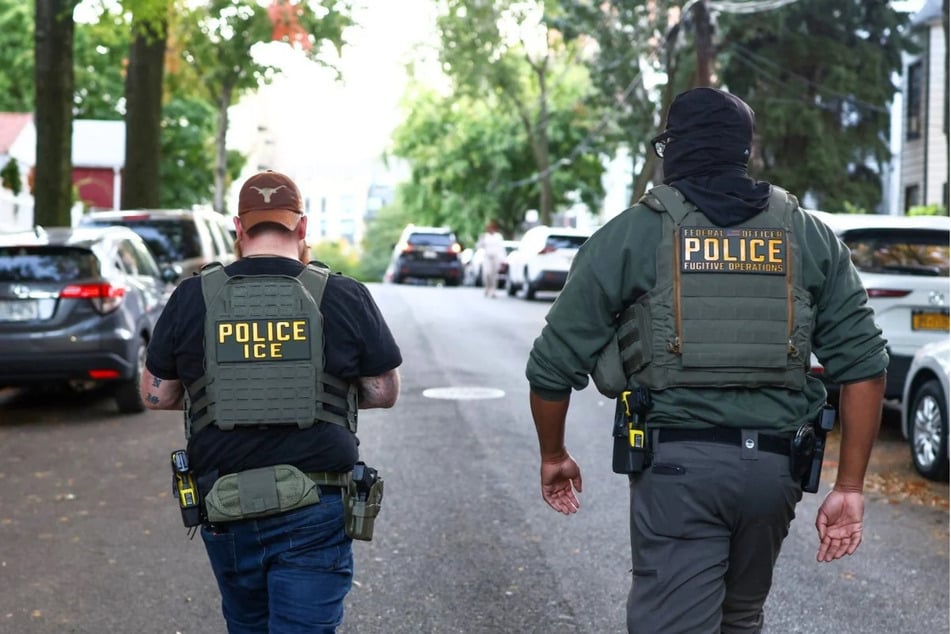 Federal agents walk near the scene where a man was shot by an Immigration and Customs Enforcement (ICE) officer during an operation in the Bronx borough of New York on October 8, 2026. On Friday, a federal appeals court ruled that migrants detained in President Donald Trump's crackdown had no Constitutional right to a bond hearing.