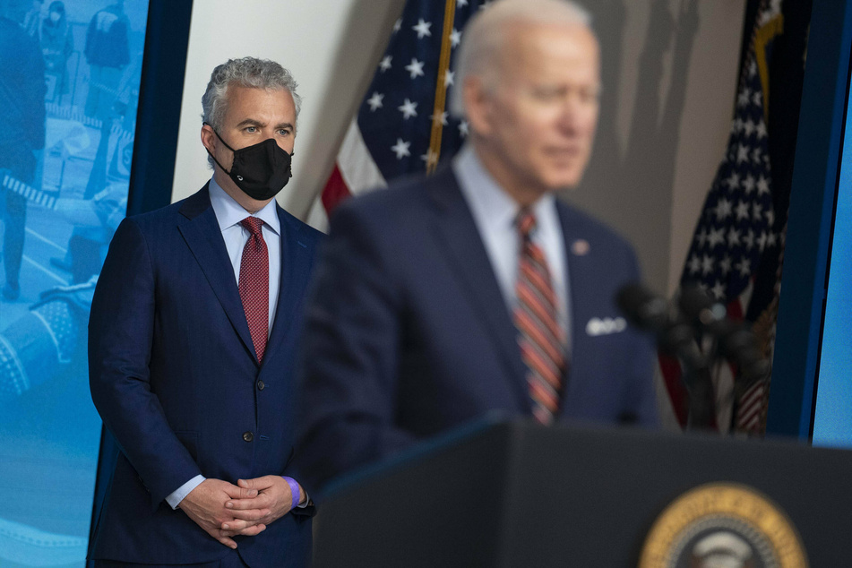 White House Covid-19 Response Coordinator Jeff Zients listens as President Joe Biden announces that the US achieved its goal of administering 200 million vaccine shots in his first 100 days in office on Thursday.