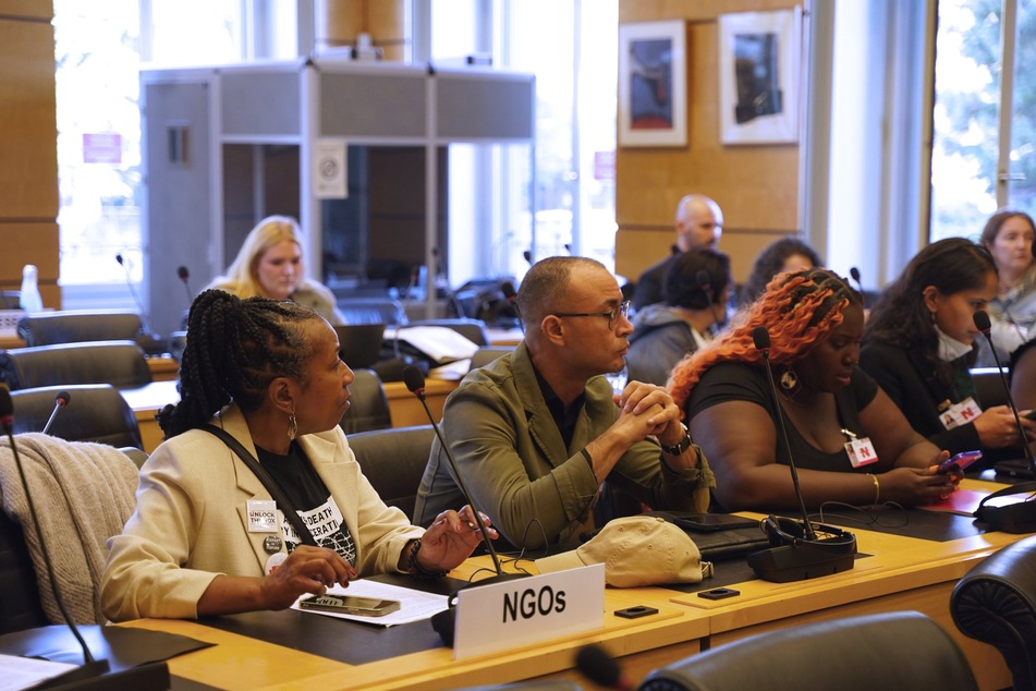 Robert Saleem Holbrook (c.) of the Abolitionist Law Center awaits his turn to testify on death by incarceration before the United Nations Human Rights Committee.