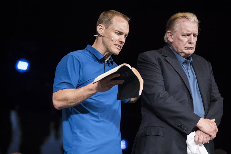 Donald Trump making a surprise visit to McLean Bible Church in Vienna, Virginia, where pastor David Platt (l.) prayed for him, on June 2, 2019.