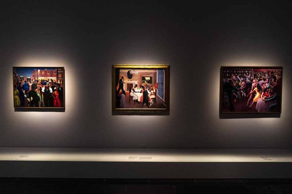 Paintings by artist Archibald J. Motley, Jr. depicting nightlife are on display at Harlem Renaissance Exhibition at The Metropolitan Museum of Art in New York City.