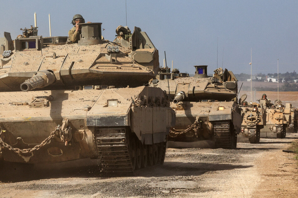 Israeli tanks mass near Gaza as Palestinians have been ordered to evacuate the northern part of the strip ahead of a ground invasion.