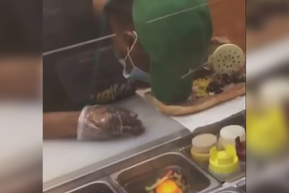 Suddenly her head lowers and she falls asleep on the sandwich.