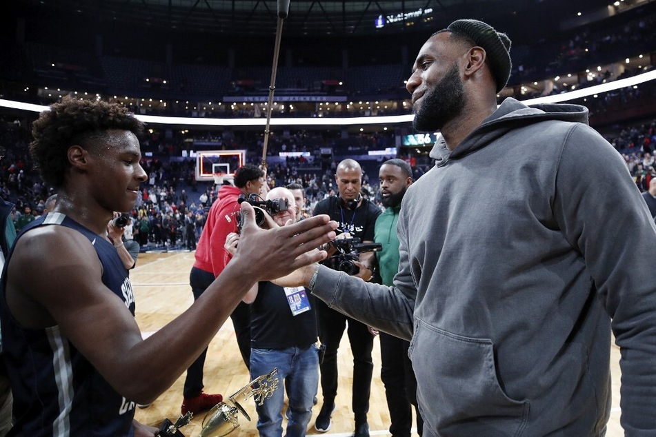 LeBron James (r) has publicly admitted that he wants to play in the NBA with his two sons before retiring.