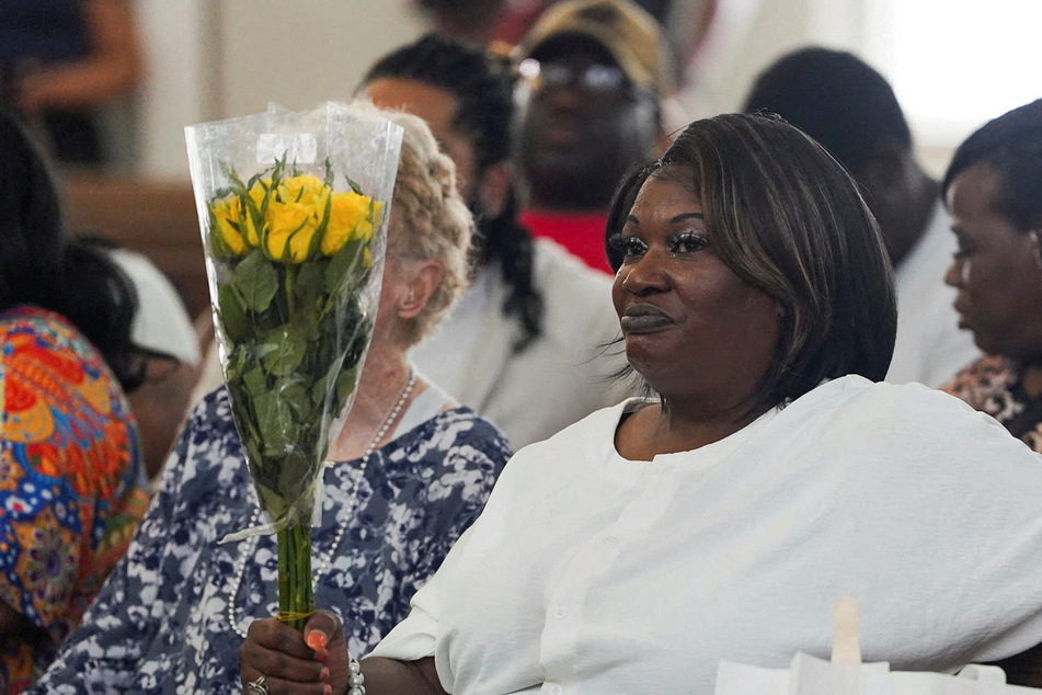 April Newkirk, mother of Adriana Smith, listens to speakers as family and community members gather on her daughter’s birthday to celebrate her life and to rally against Georgia’s abortion ban on June 15, 2025.